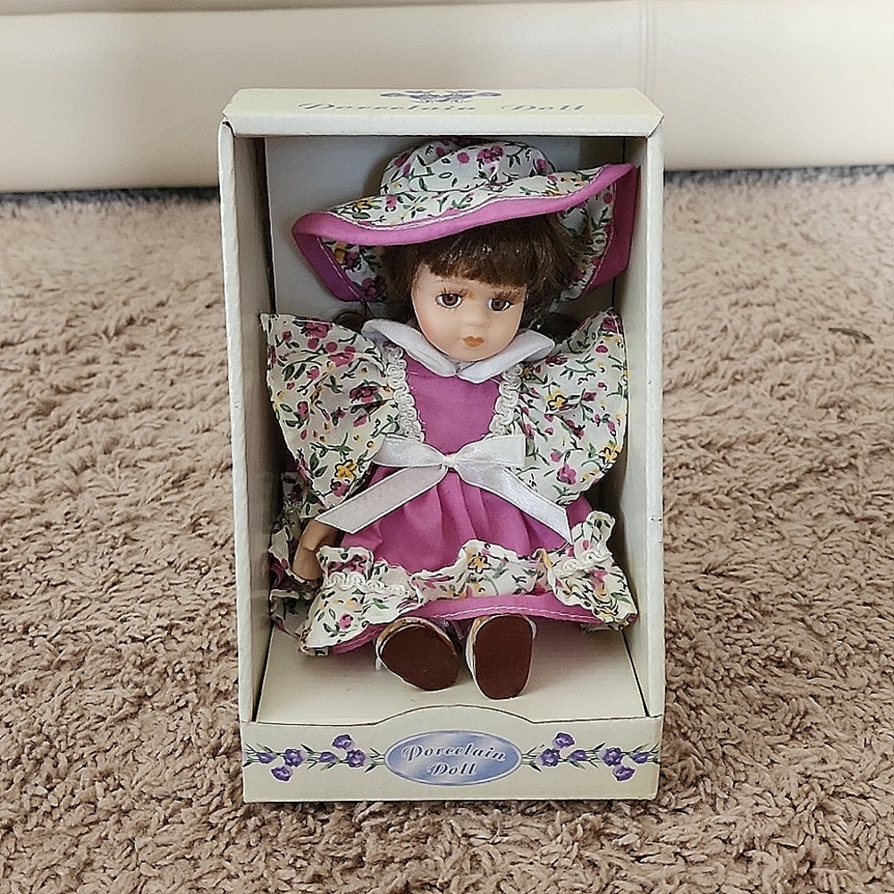Porcelain doll 7.5in x 5in x 4.5 in, measured on the box.